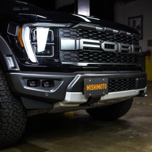 Ford F-150 Tow Hook License Plate Relocation Bracket - Mishimoto - 4mm-thick Powder Coated Steel - Semi-gloss black - `15-`27