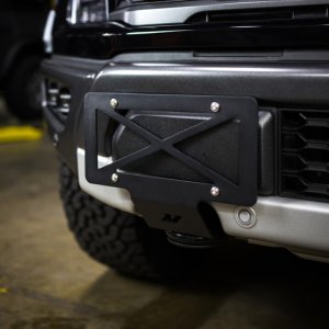 Ford F-150 Tow Hook License Plate Relocation Bracket - Mishimoto - 4mm-thick Powder Coated Steel - Semi-gloss black - `15-`27
