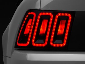 Ford Mustang LED Taillights - Rear - Raxiom - Icon - Black Housing (Smoked Lens) - `99-`04
