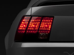 Ford Mustang LED Taillights - Raxiom - Black Housing - Smoked Lens - `99-`04