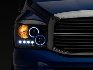 Dodge RAM 1500 LED Halo Projector Headlights - Raxiom - Black Housing with Clear Lens - Black - `06-`08