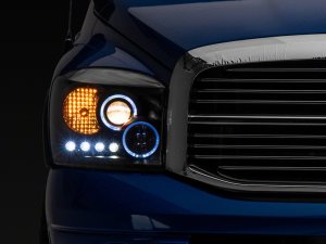 Dodge RAM 1500 LED Halo Projector Headlights - Raxiom - Black Housing with Clear Lens - Black - `06-`08