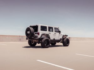 Jeep Wrangler JK Rear Bumper Mid Width w/Tire Carrier Assembly - Rear - Road Armor - Stealth - Tex Blk - `07-`18